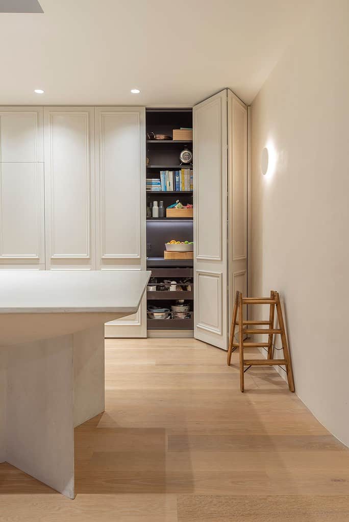 Example of Hettich's Wingline L used to reduce the clearance space required for a large pantry door. Kitchen designed by Morgan Cronin of Cronin Kitchens
