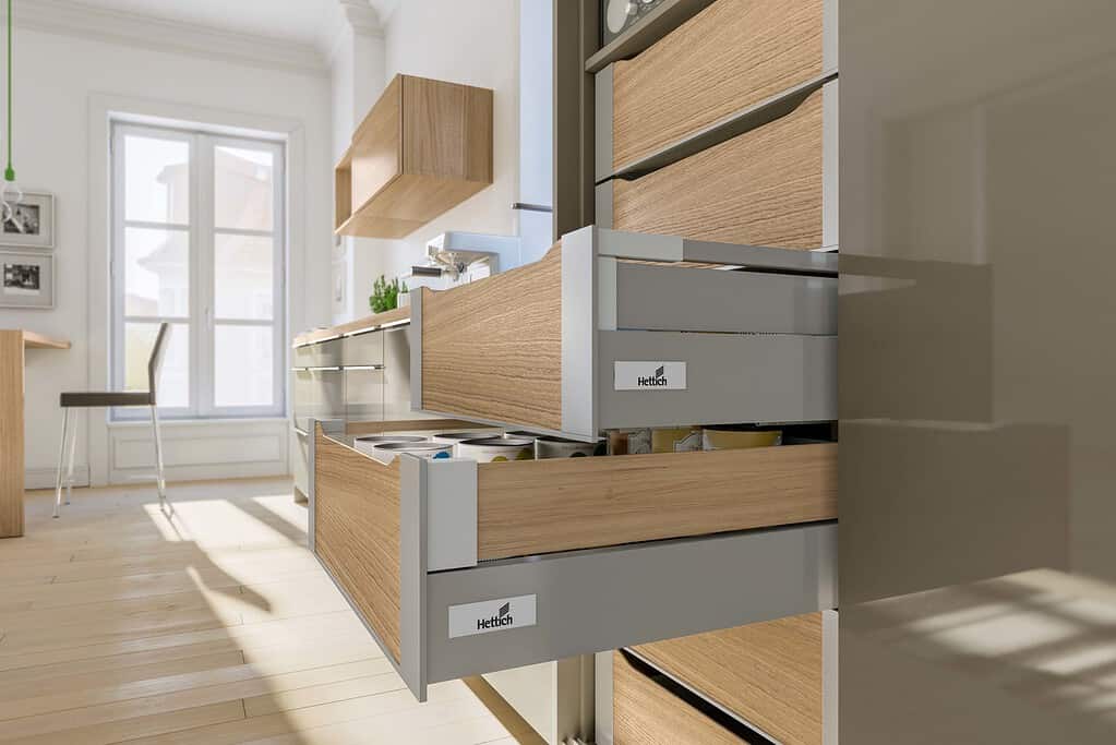 A tall pantry stacker with Hettich's InnoTech Atira drawers in silver, with woodern Design Sides and internal fronts. The best access to all your pantry items.