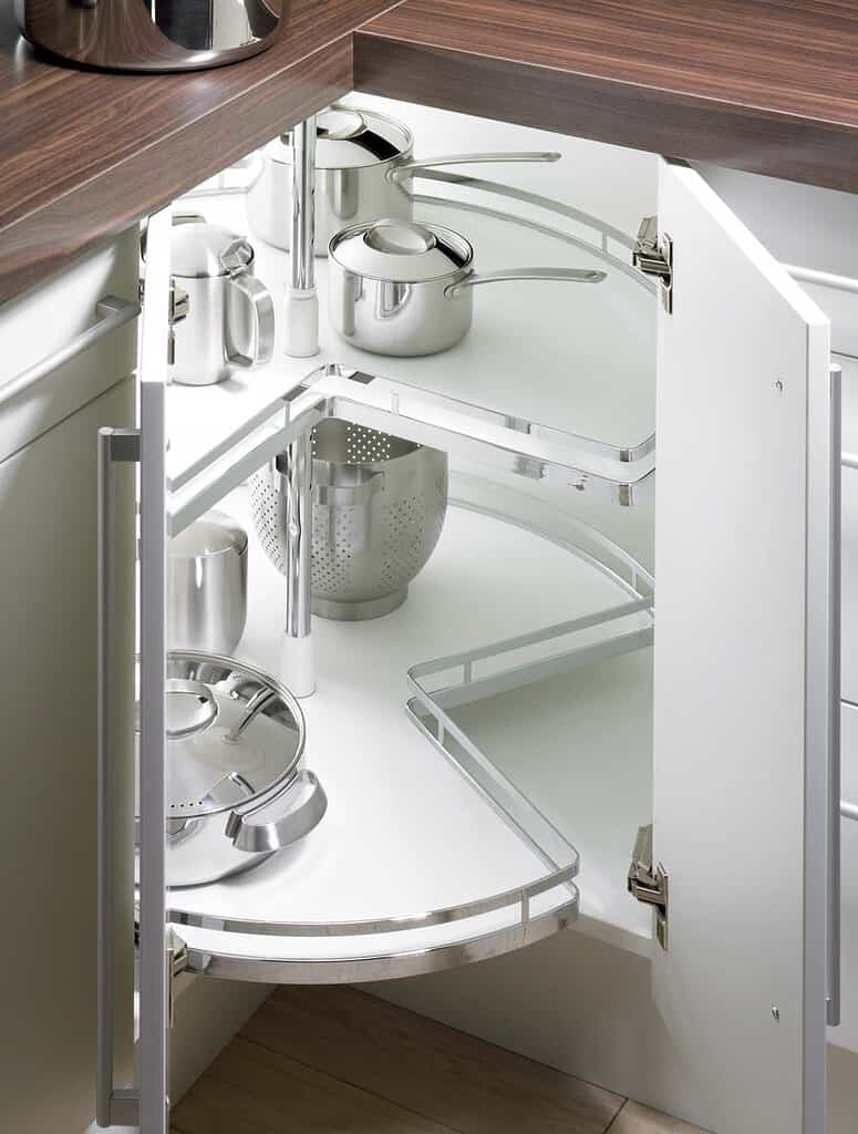 A corner carousel in white in a tricky corner cupboard. These are rotating internal shelvers for super easy access