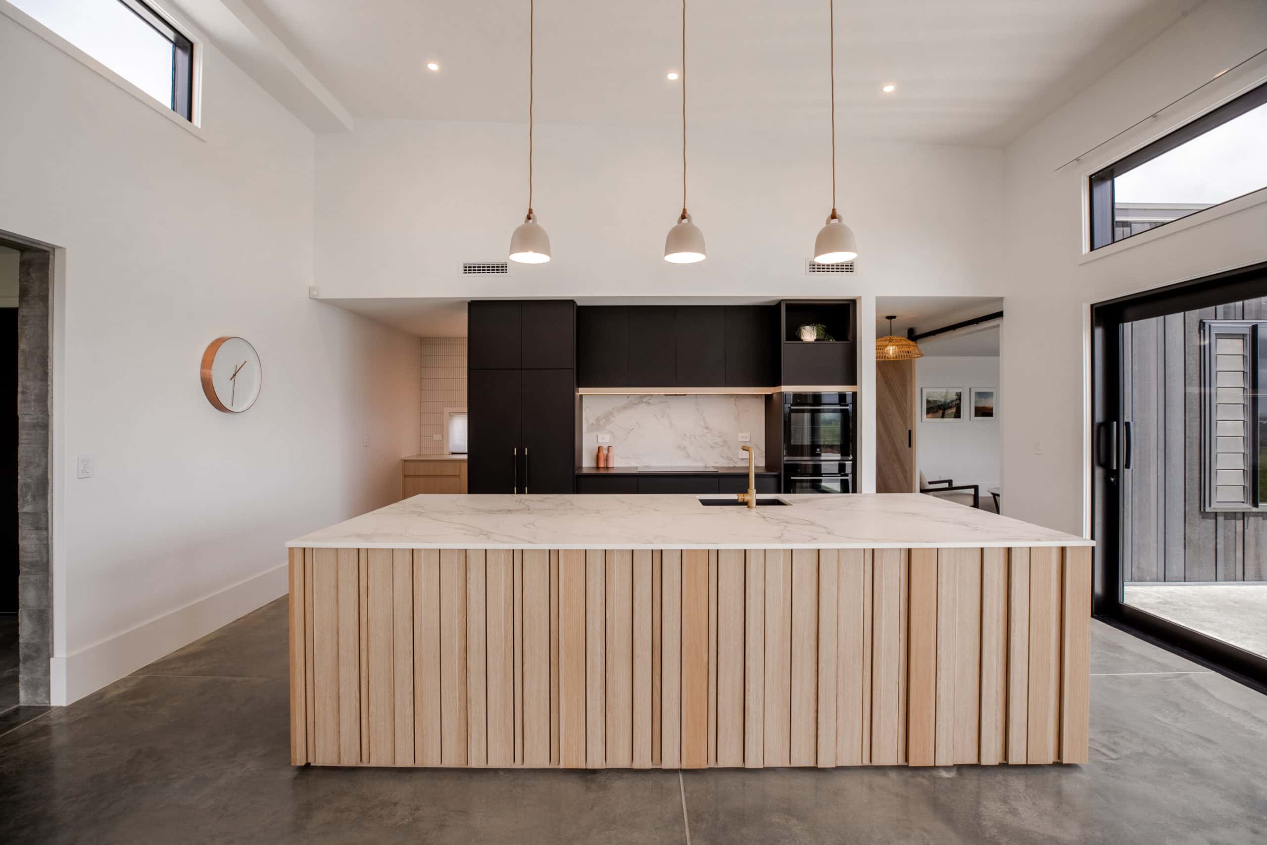 Bold Dark Kitchen with Soft Natural touch