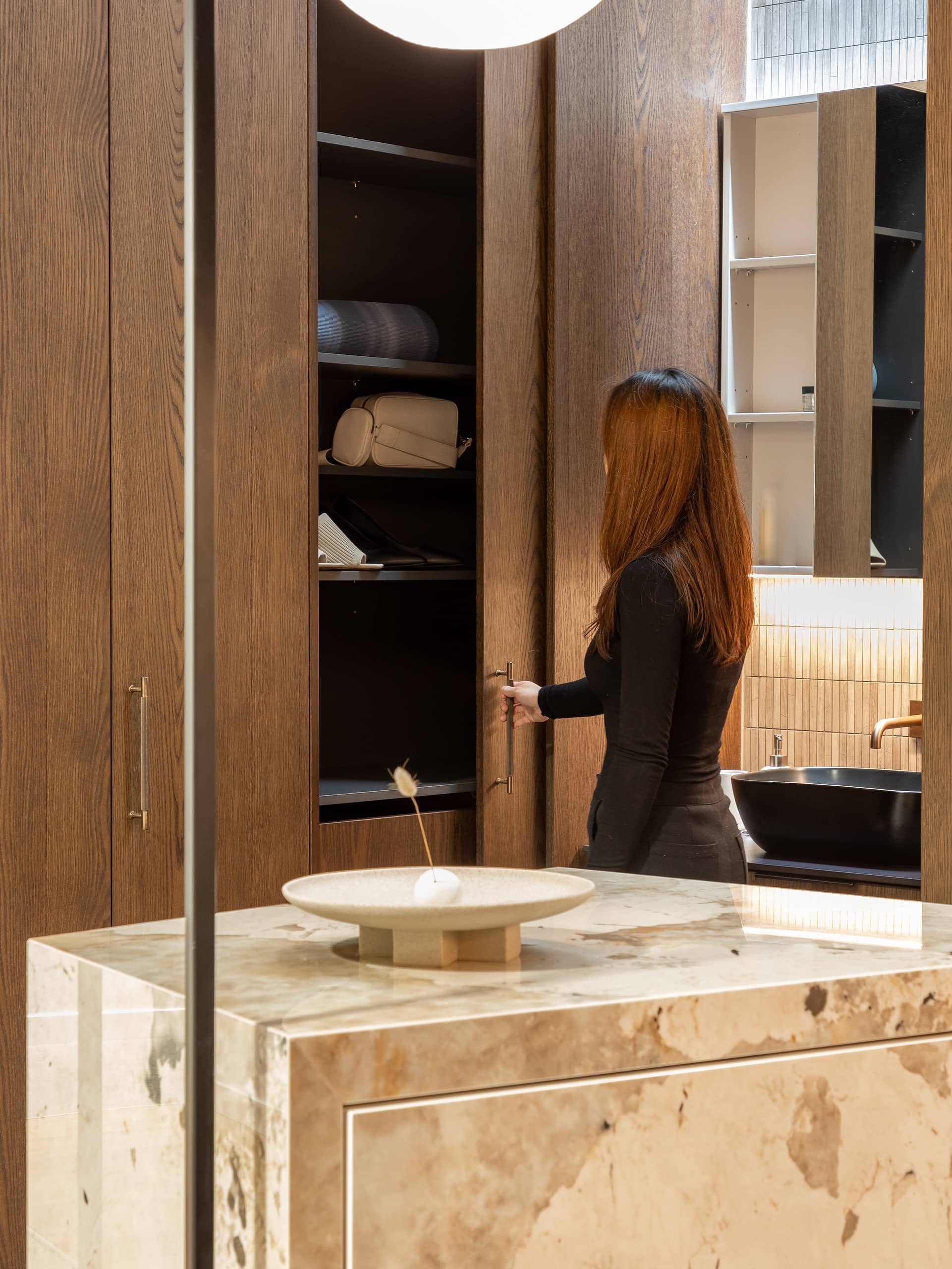 Luxury showroom with wooden sliding doors for a wardrobe and sliding mirrored bathroom