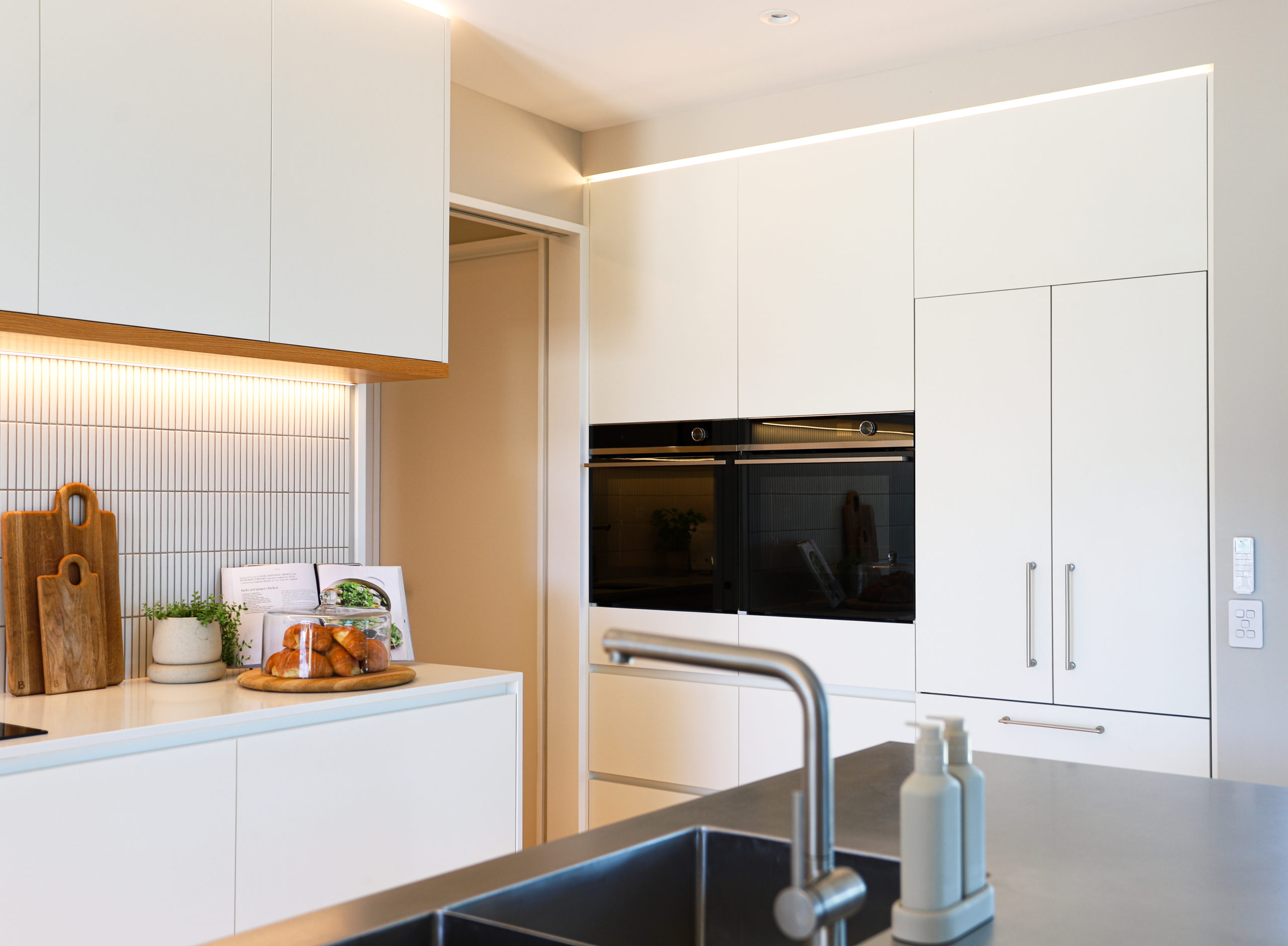 Dual benchtops in chef-inspired kitchen