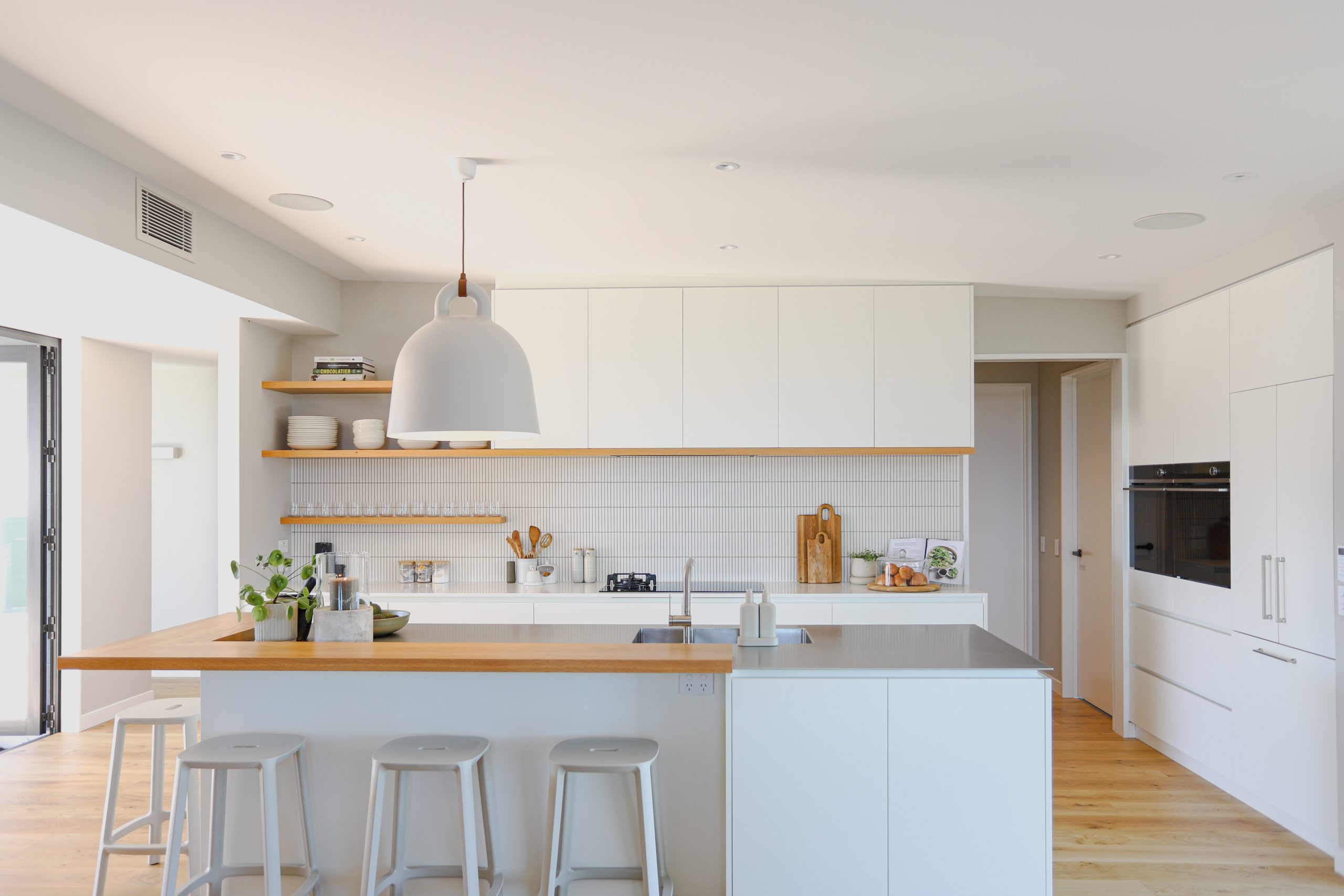 A kitchen crafted by the Custom Space that sets the tone for calm tranquility throughout the project